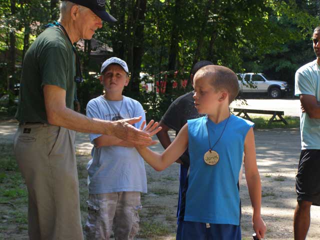 Adult working with youth at Pilgrim Lodge